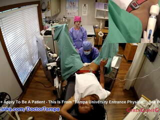 Naughty nurse Lilly Lyle discovers Nikki Star's hidden treasure during a routine gynecological exam in a college dorm