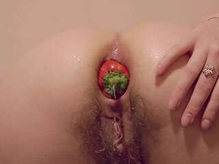 Russian brunette enjoys intense anal penetration with a wide bell pepper in the kitchen