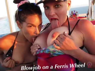 Unforgettable outdoor threesome: Hot teen and experienced MILF give each other oral pleasure on a Ferris wheel