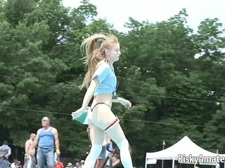 Young amateur girl performs at party, excites audience